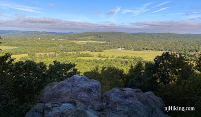 View over hills and valleys from a rocky outcrop