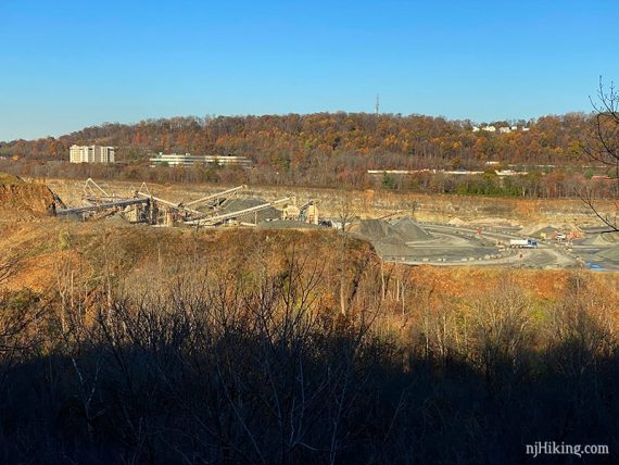 View of a rock quarry from a trail overlook.