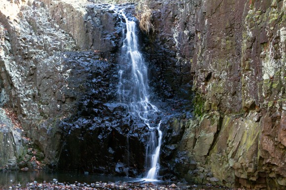 Hemlock Falls tumbling over basalt rocks in South Mountain Reservation.