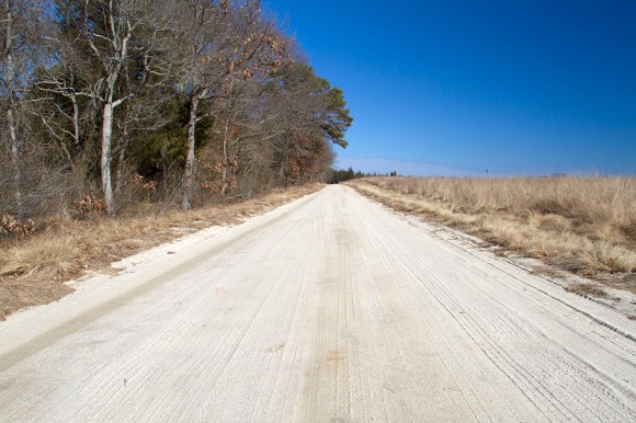 Wide white sand road.