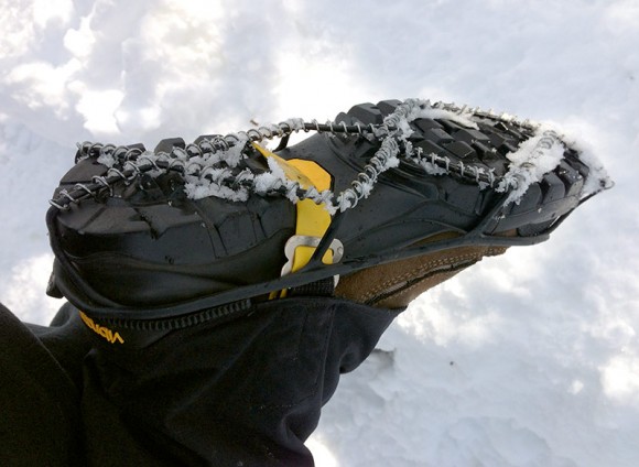 Bottom of a hiking boot with YakTrax coils attached to it.