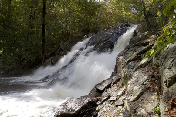 Chikahoki Falls with heavy rushing water down a slanted rock face.