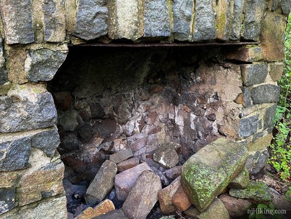 Inside a stone fireplace.