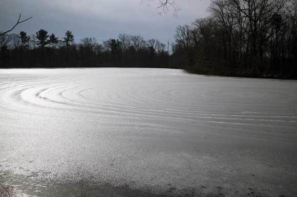 Frozen lake with concentric circle pattern.