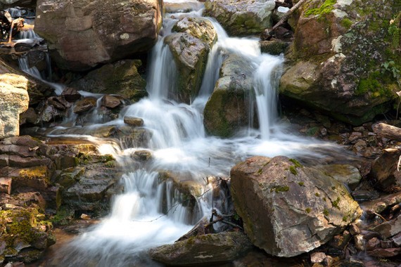 Cascades pouring over rocks.