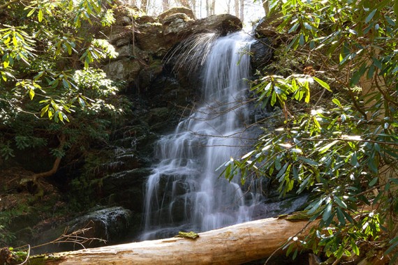 Sprays of water spritzing off the top of Silver Spray Falls.