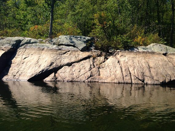 Low water level line seen on rocks around on Splitrock Reservoir.