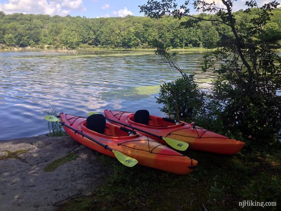 Two kayaks on a rocky spot on an island on Splitrock Reservoir.