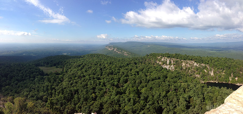 Panoramic view over green forest and white cliffs of New York’s Shawangunks.