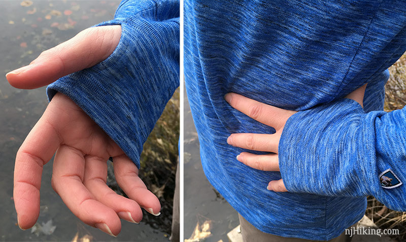 Thumb holes on the sleeve of a blue shirt.
