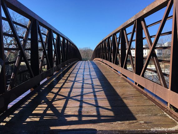 Arched metal footbridge.