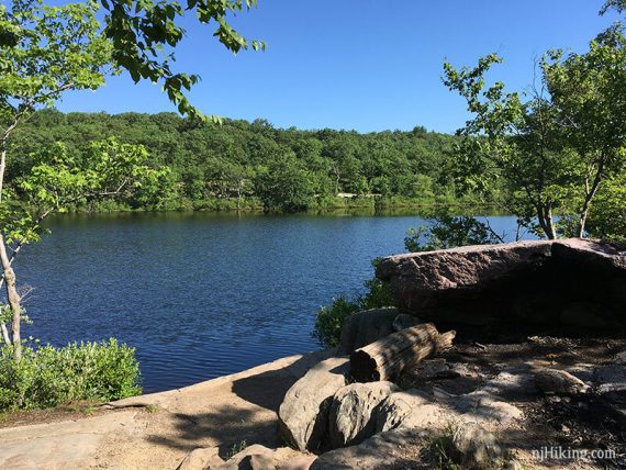 Surprise Lake with rocks in the foreground.