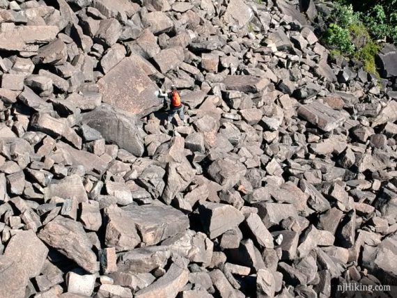 Hiker navigating the large rocks of the Giant Stairs in the Palisades.