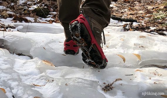 Mircospikes winter tracks on a hiker on ice.