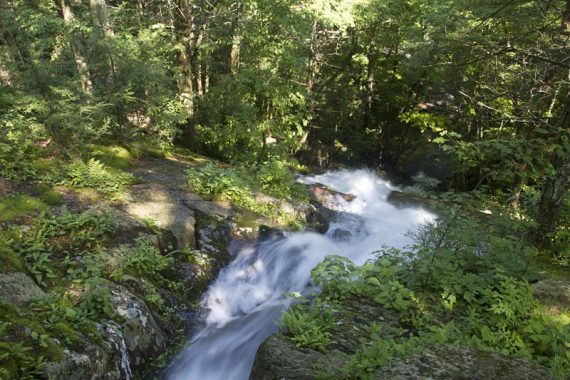 Looking down a heavily flowing waterfall.