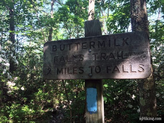 Buttermilk Falls sign at the junction with the Appalachian Trail.