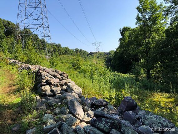 Stone wall and cross a power line cut