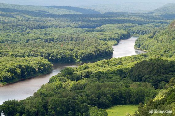 Zoom into the Delaware River with forests on either side.