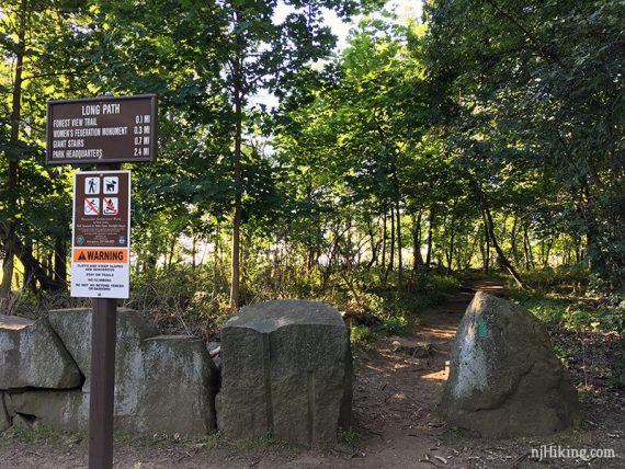 Long Path sign by a break in a row of rocks for a trail.