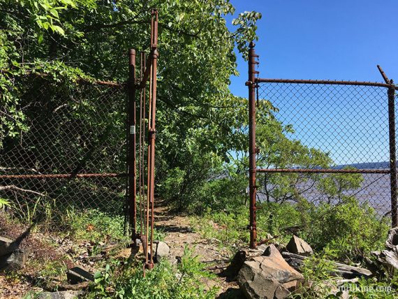 Hike from New Jersey into New York through a break in a chain link fence.