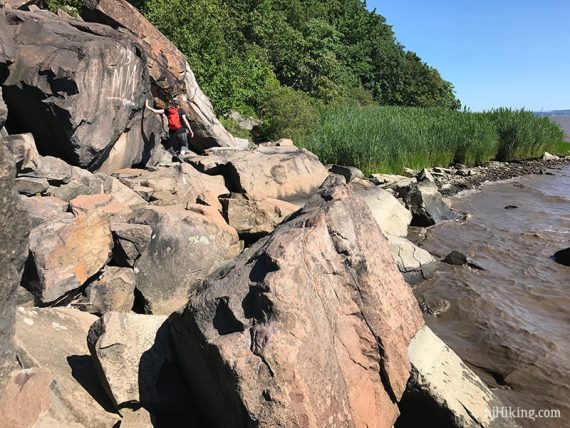 Hiker walking along huge boulders of the Giant Stairs.