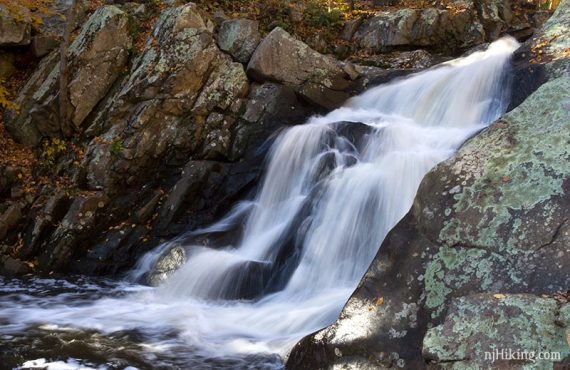 Waterfall flowing over rocks.