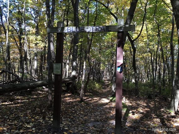 Wooden arch with "Blue Trail" painted on it.