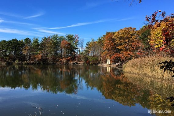 Bright fall foliage reflected in Perinne Pond.