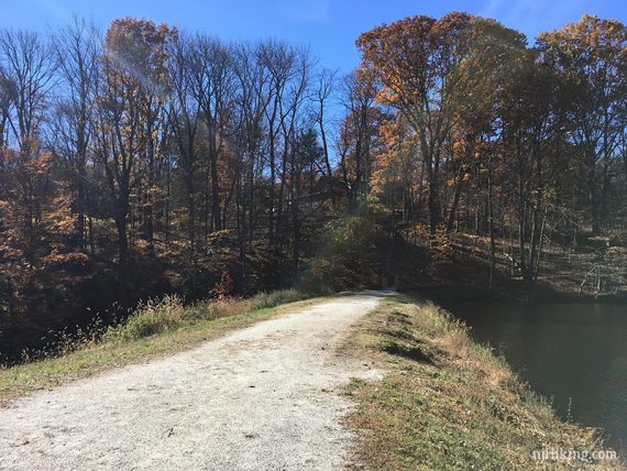 Dirt path over a dam.