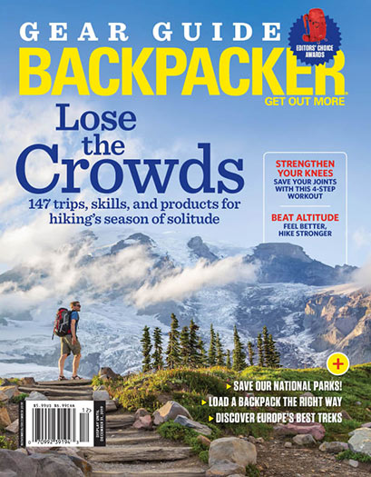 Backpacker Magazine Cover with a hiker in front of a mountain range.
