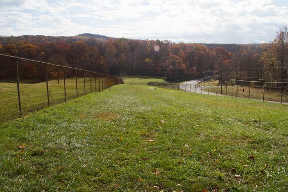 Crossing the grassy area near the dam