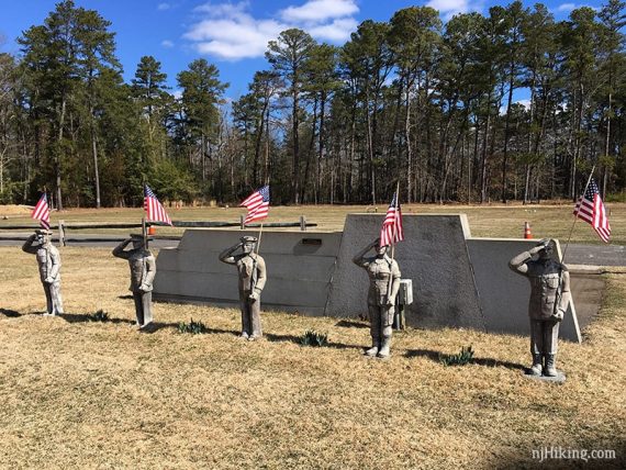 Stone solider statues at a cemetery,