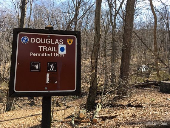 Douglas Trail sign with Laurel Falls beyond.