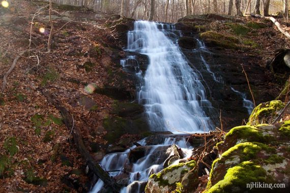 Laurel Falls with sunlight streaming over it.