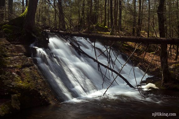 Waterfall down a steeply angled rock face.