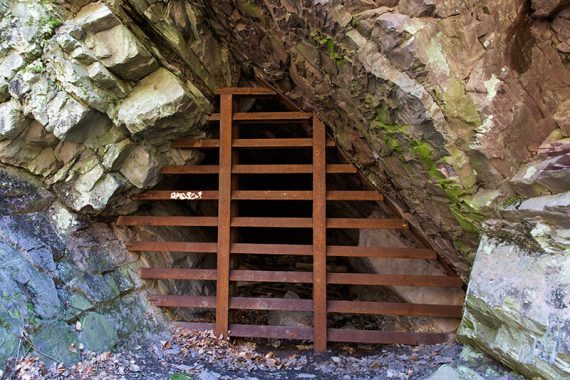 Metal bars blocking a mine shaft entrance, 2016