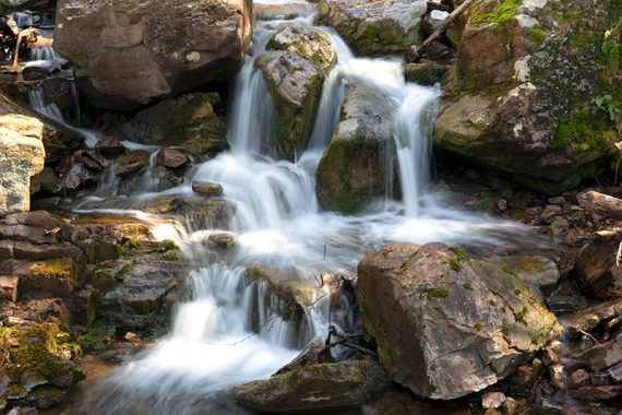 Close up of water cascades near a bridge, 2016