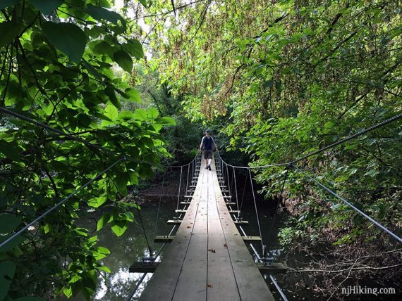 Crossing the swinging bridge.