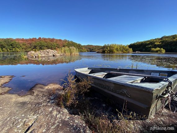 Rocky outcrop with a boat on Butler Reservoir.