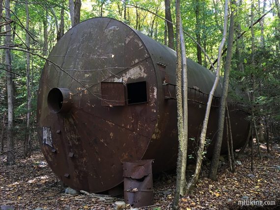 Tall metal water tank.