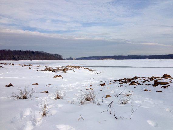 Snow at the edge of a reservoir