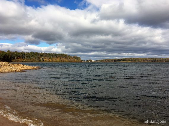 Waves on a reservoir and fluffy white clouds in the sky