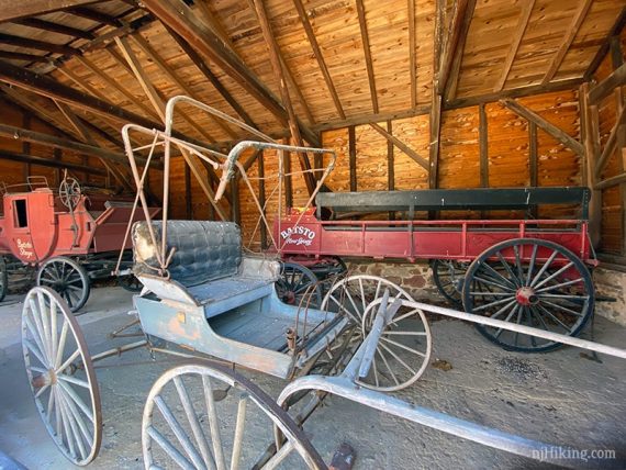 Batsto carriages in a barn.