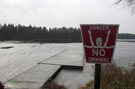 Danger no swimming red sign.