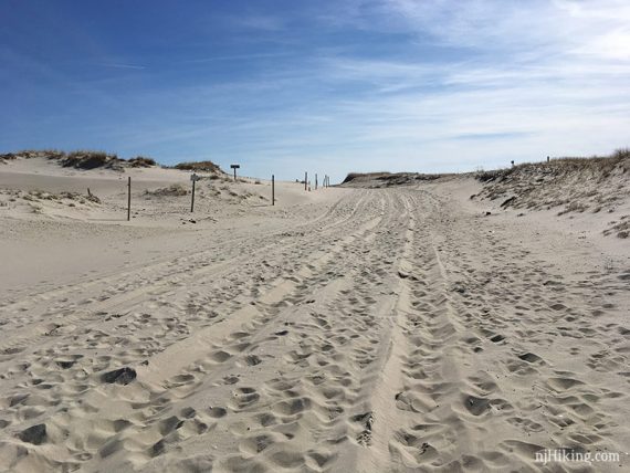 Deep sand with footprints and tire tracks from P23 to Barneget Inlet Beach