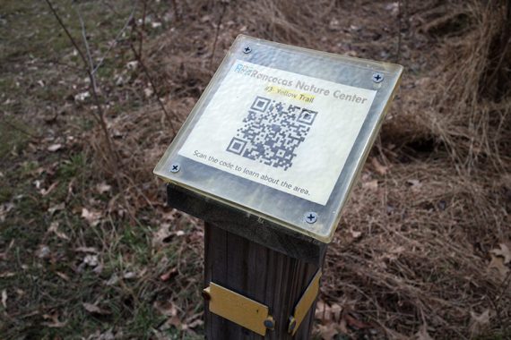Trail post with QR code to scan for info.