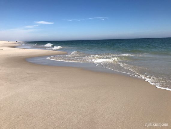 Sandy beach with waves lapping at edge