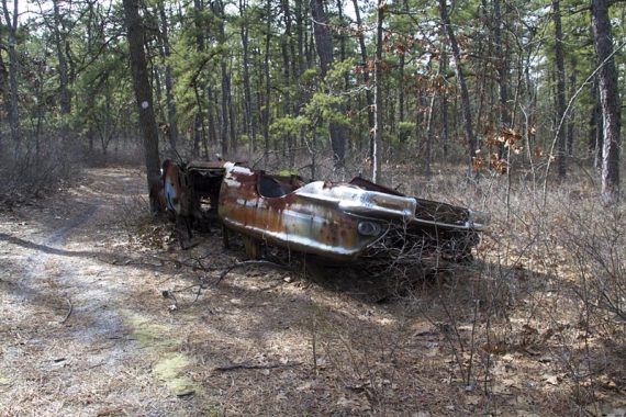 Rusted out car chassis along the trail