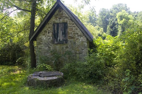 Building and well near the farm's pond