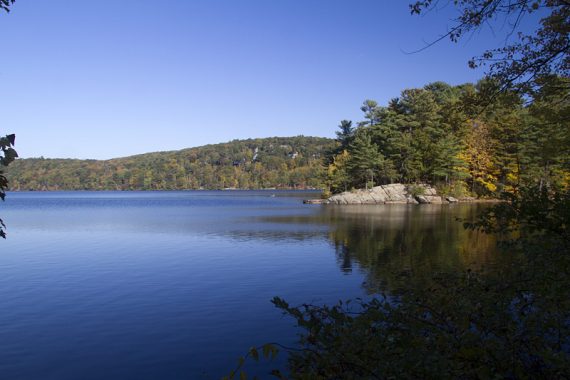 Sterling Lake with a rocky outcrop along the shore.
